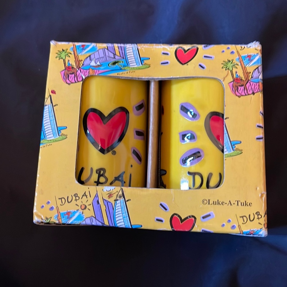 Brand new set of salt and pepper shaker with dubai art and famous buildings.